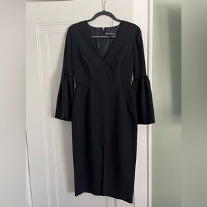 Statement sleeve black tie dress